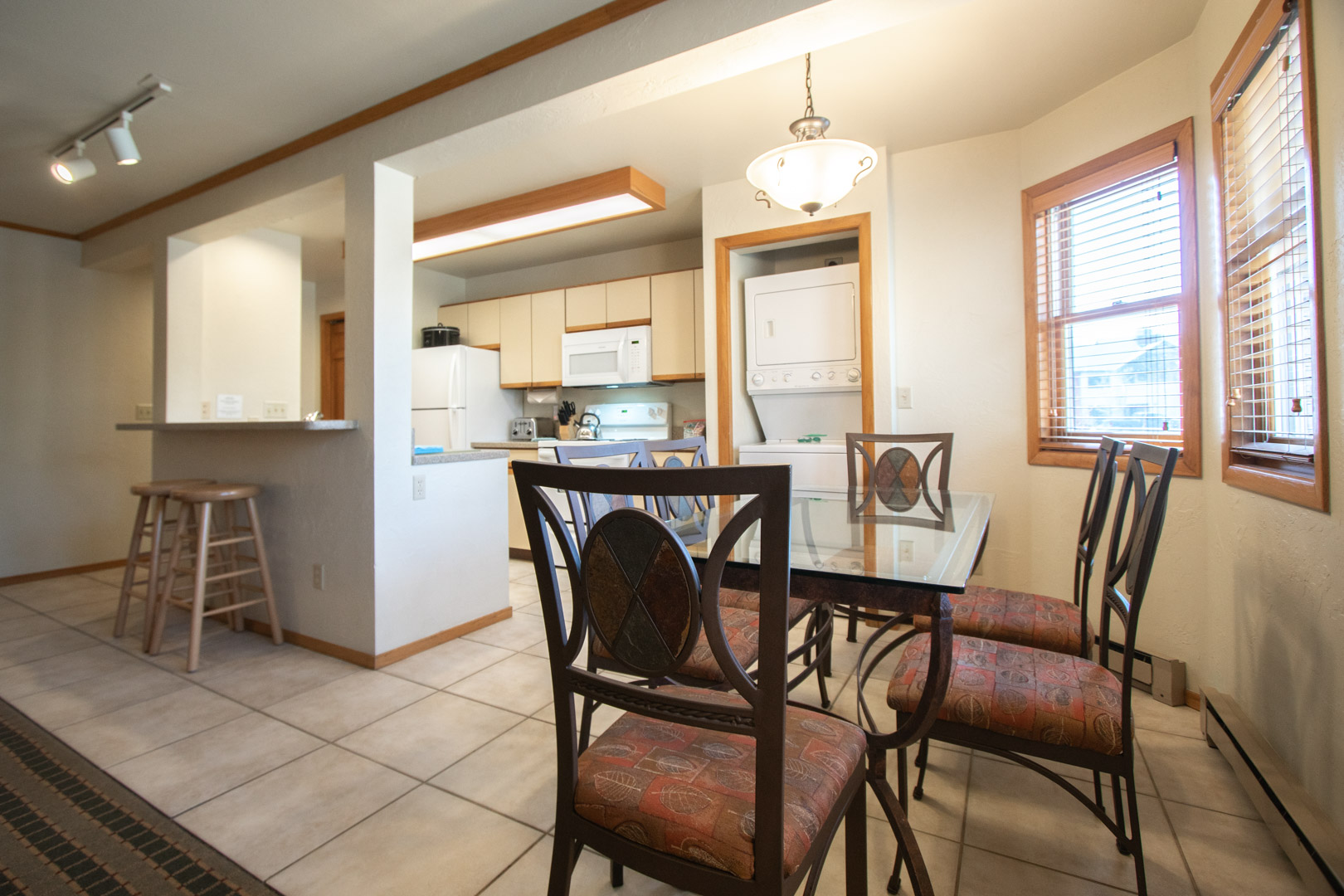 A fully equipped kitchen and dining table at VRI's Sunburst Resort in Steamboat Springs, Colorado.